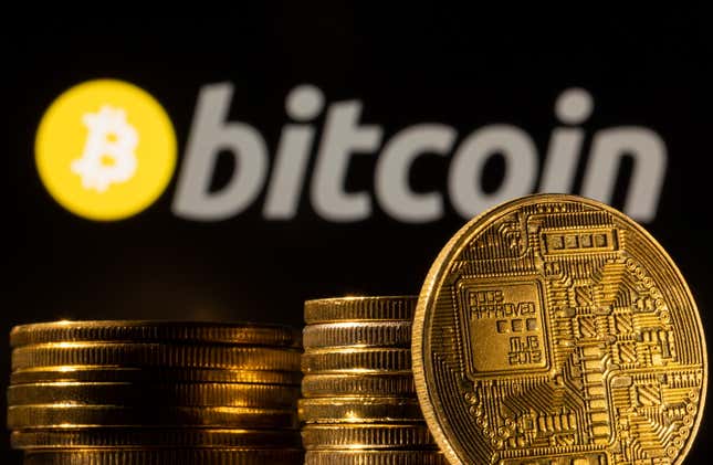 Bitcoin soars to record high, then tumbles | Reuters