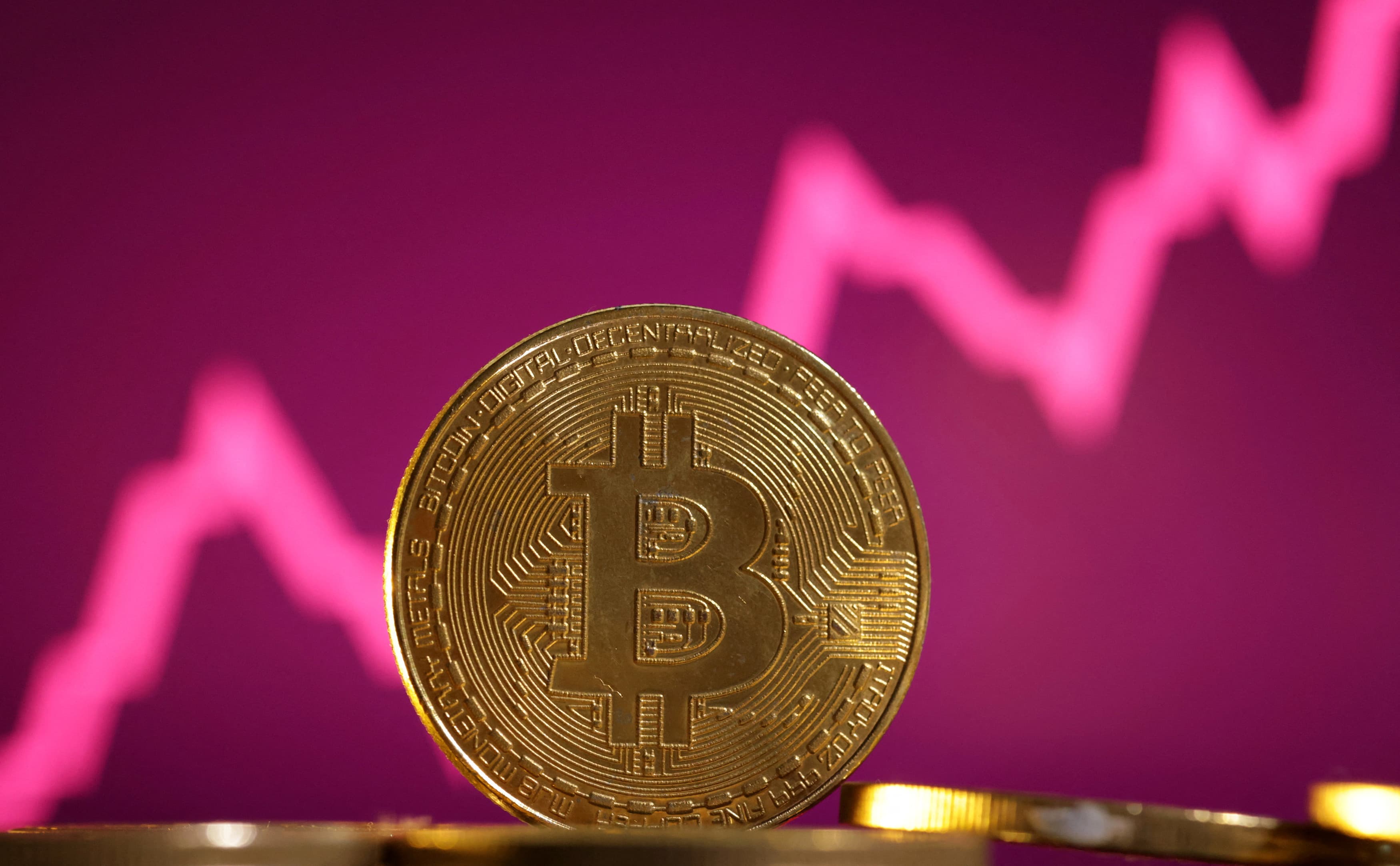 Bitcoin rises to record high over US$70,, Wealth - THE BUSINESS TIMES